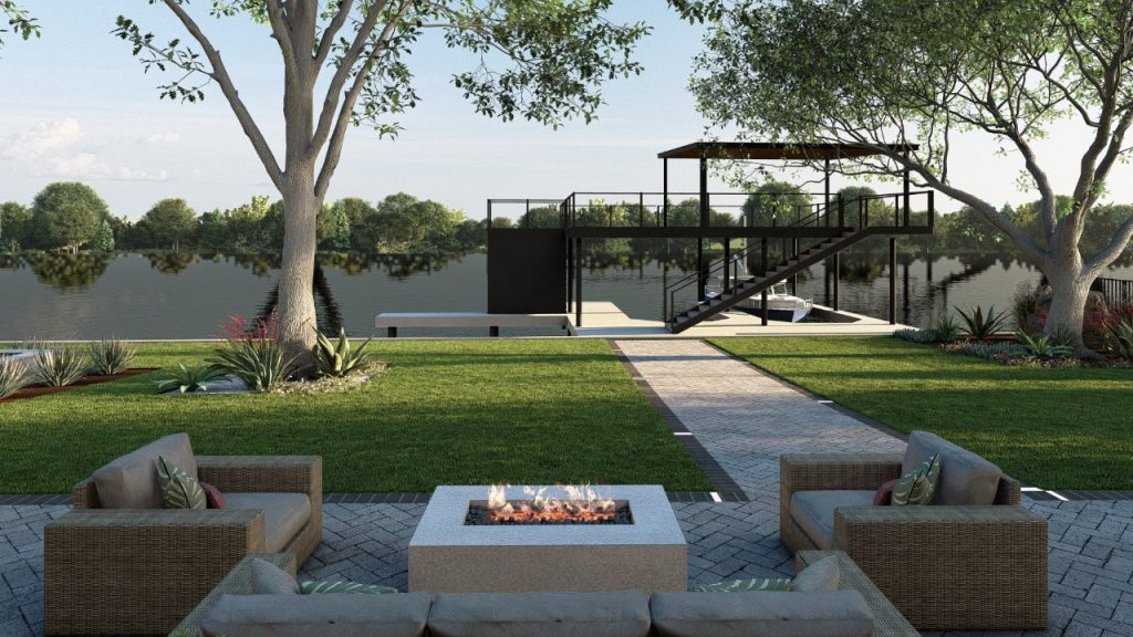 Fire pit lounge on patio overlooking lawn, pathway, and modern two-story boat dock on lake.